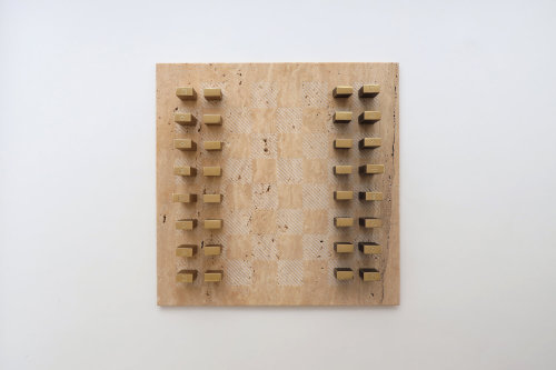 Tarek Elkassouf‘s chess setMaterial: Carrara marble board with Brushed Stainless Steel and Gun Metal