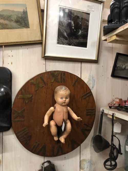 shiftythrifting:Some VERY haunted dolls in an antique shop in vermont -WHY IS THE BABY IN A BOTTLE I