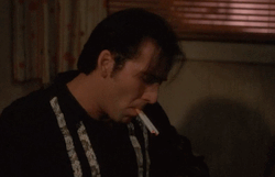 Smokeonfilm:nicolas Cage Smoking Two Cigarettes In Wild At Heart.