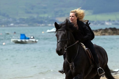 possiblestalker:If your day isn’t quite majestic enough, here. Have Gillian Anderson riding a damn horse