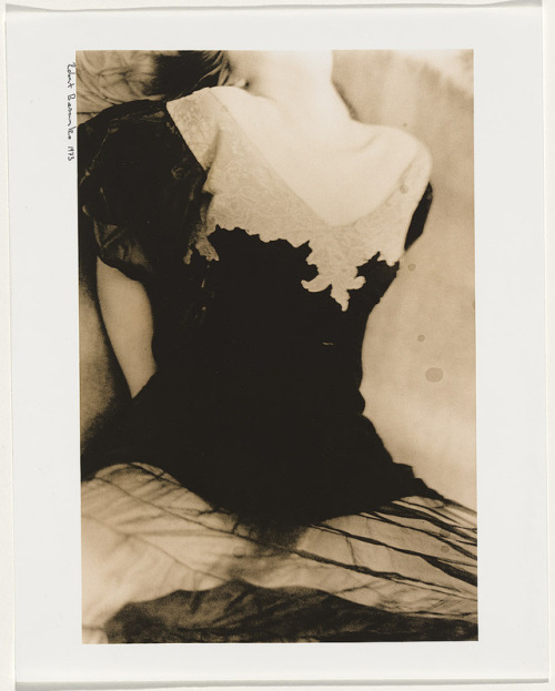 Robert Besanko: (Woman wearing a black top lying with her head back and legs apart), 1973