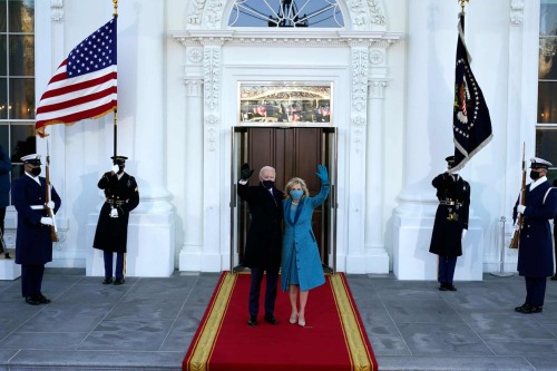 Joe Biden and Jill Biden wave as they arrive at the North Portico of the White House, Alex Brandon, 