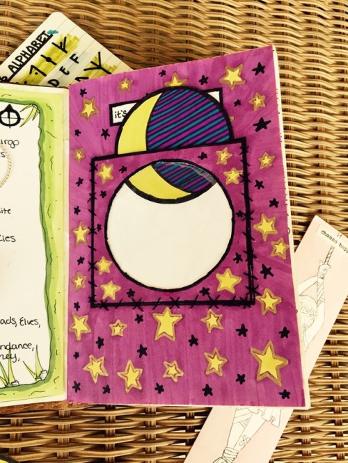 kitteninacauldron: I made a little moon window in my grimoire with different inserts so I can make i