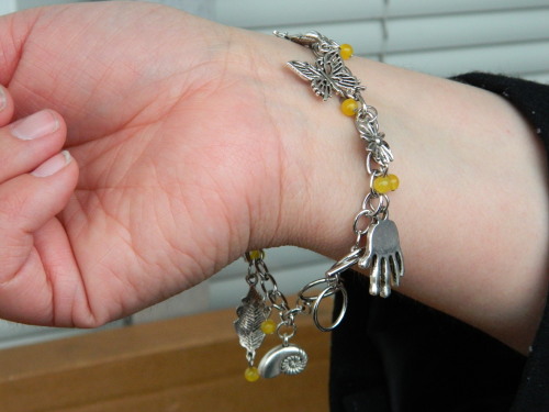 Updated my Fringe glyph code charm bracelet with a new chain so I would have room to incorporate the