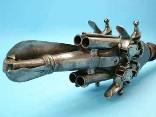 An usual Spanish or Italian polearm with spring loaded folding spear head and four flintlock pistols