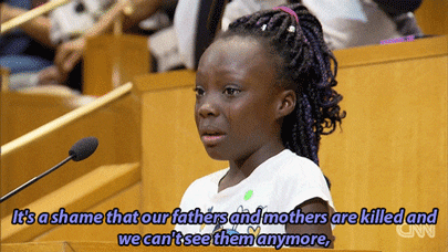 bellygangstaboo:A young girl climbed up a step ladder to stand at the podium before a tense Charlott