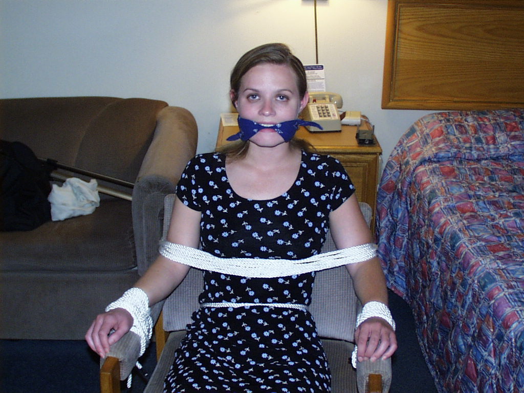 graybandanna:  Tied to a chair with a big blue bandanna gag 