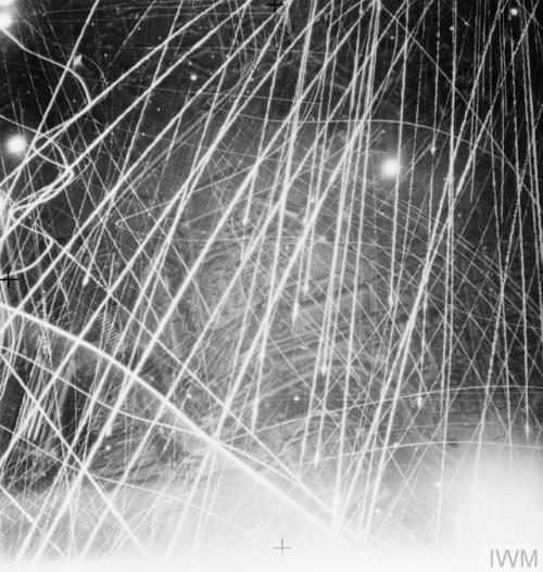 uss-edsall:Tracer from German anti-aircraft gun fire (flak) vividly depicted in a vertical aerial ph