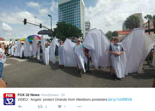 lovemysub:  ladypoisonivy91:  micdotcom:  “Angels” block the Westboro Baptist Church from protesting Orlando victim’s funeral When a handful of Westboro Baptist Church members showed up Saturday at the funeral of Orlando shooting victim Christopher