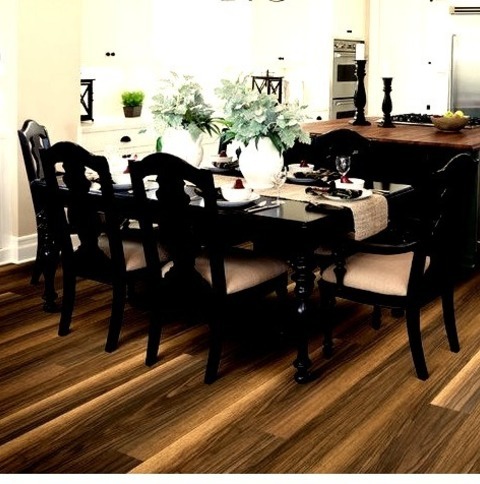 Traditional Dining Room
Inspiration for a sizable traditional kitchen/dining room makeover with a brown floor, beige walls, and no fireplace.