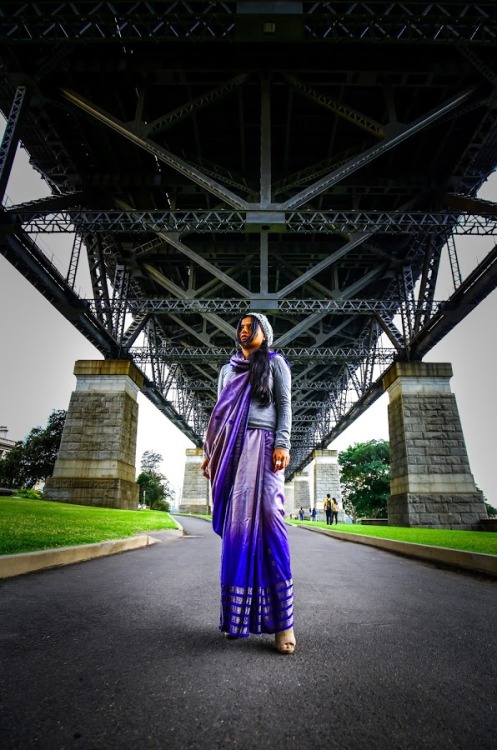 Under the bridge in an everyday saree