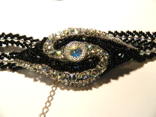 It is finished! This piece took 6 hours, and boasts 62 swarovski crystals. It is astonishingly spark