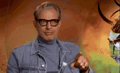 Jeff Goldblum makes the "lips are sealed" hand motion