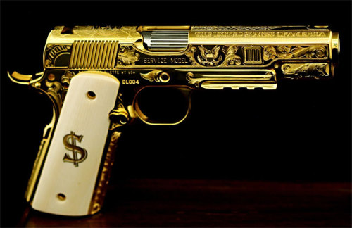 gunrunnerhell:  United States of AmericaGold plated and engraved custom 1911 from DL Sports, not much other info on it. Serial number 4 but I don’t know how many they made total or if they’re a custom made-to-order pistol. No price is mentioned either.