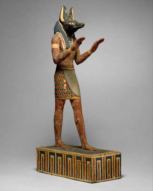 Statuette of the deity Anubis (plastered and painted wood).  Artist unknown; 332-30 BCE (Ptolemaic p