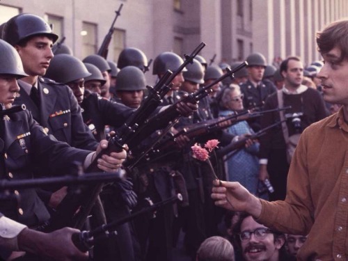 sixtiescircus:Protester holds up flower to armed soldiers (1968)