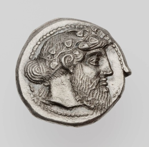 Silver drachm of Naxos with head of Dionysus (obverse) and bearded Silenus holding kantharos (revers