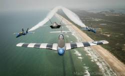 centreforaviation:  P-51 Mustang in formation with 2 Blue Angels F-18s and a F-22 Raptor