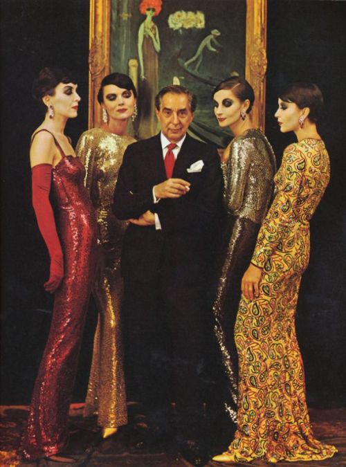 Fashion designer Norman Norell standing amongst his muses in Life Magazine photograph by Milton Gree