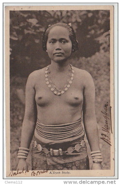   Dyak woman, via Delcampe.  