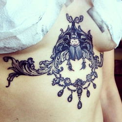 thievinggenius:  Tattoo done by Sara Fabel.