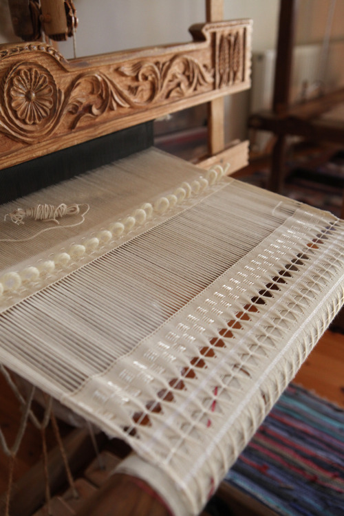 Recurrent sections of unwoven warp is an element inspired by Greek clothing depicted on historical p