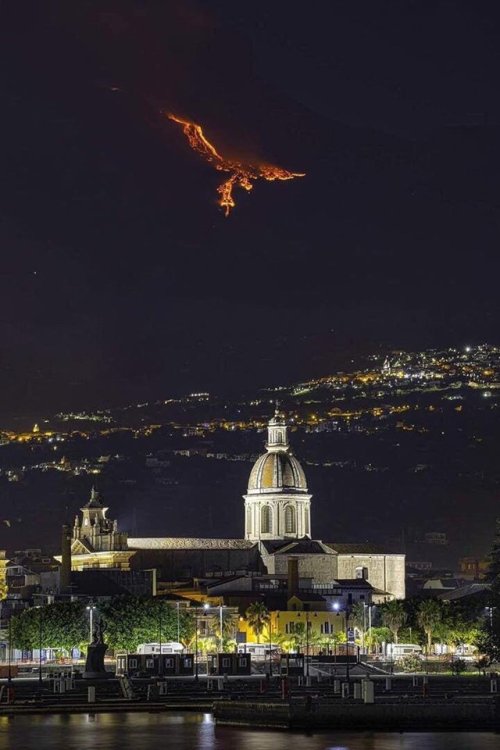 It’s a night view of an eruption on Mt. Etna in Italy - but it sure looks like some winged demon ove