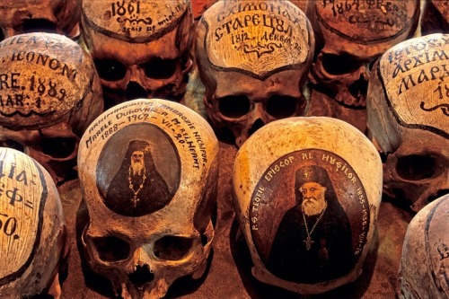 Dated skulls, Romania - The skulls in the ossuary of the 15th century Neamt Monastery bear little texts stating the names and dates of the monks. Photo Mick Palarczyk.