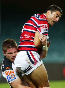 roscoe66:  Anthony Minichiello of the Roosters is tackled by Chris Lawrence of the Tigers 