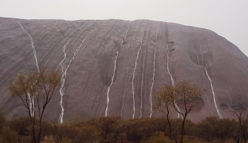 A rare rainfallUluru, that grand tan sandstone monolith gracing the desert wastes of Central Austral