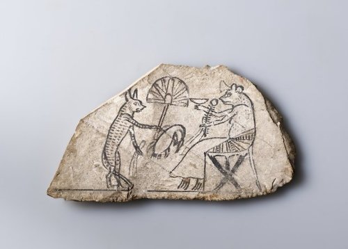 historyarchaeologyartefacts:Fragment depicting an anthropomorphic cat making an offering to an anthr