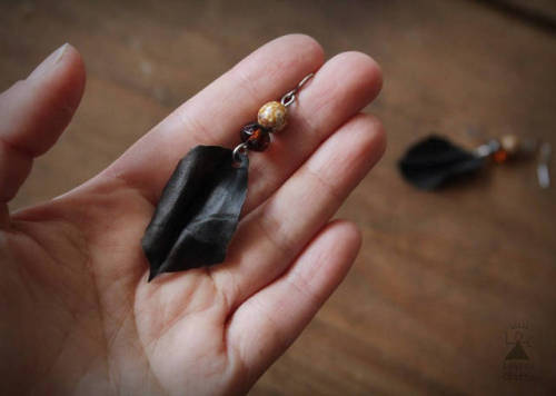 A pair of handmade leaf earrings, super light and crafted from up-cycled raw deer hide.Bathed in Fin