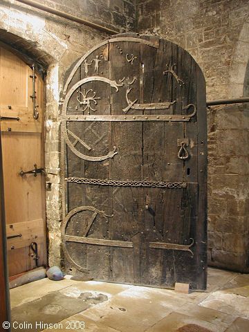 ltwilliammowett:

A Viking Longship on a door in the St. Helen’s Church in Stillingfleet, Yorkshire, c. 10th century, photo by Colin Hinson 2008 St Helen’s Church in the Yorkshire village of Stillingfleet was built around 1154 by Robert de Stuteville as a manorial chapel. Inside is a door that is probably 2th centuries older. The door is divided into two parts by a narrow horizontal mesh. There are two hinges, one in each half of the door. Both are in the shape of a giant C, the ends of which are shaped like dragon heads. At the top left there are two figures which are supposed to represent Adam and Eve. Near the figures is a circle of nails that may once have held the Tree of Knowledge, and it appears that Adam is reaching for an apple from the now-vanished tree.In the upper half of the door is the Viking longship with a magnificent dragon-headed prow and a large rudder on the ride side.Where this door was before is not known, there is even a suggestion that there may have been a previous one before this church. However, since there are no foundations to indicate this, many doubt this theory. It should be remembered, however, that the Vikings built their early churches of wood. It is therefore not unlikely that there could have been a previous building where this door was used. 