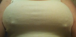 hugerealtitslover:  This is her deffinition of covering the 42JJ while at work..  Works for me lol