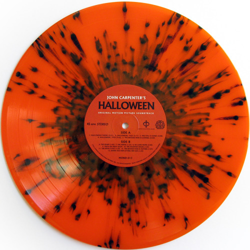 stevesrecords:  John Carpenter ‎– Halloween  Mondo, 2013  **Edition of 1,000 copies with alternate artwork on orange translucent vinyl with black splatter. See the original artwork here.