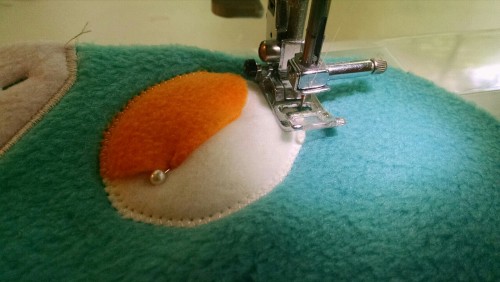 janelles-plushies:  A little lesson in appliqueing an eye onto a head: 1. Lay the head piece you will be appliqueing on a flat surface2. Lay your pattern on top of your head piece to identify where the eye will be placed and slide your tear away backing