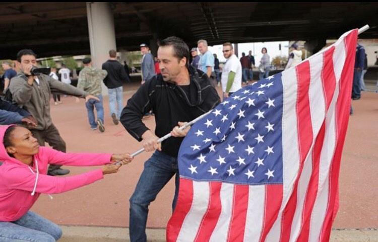 land-of-propaganda:  FERGUSON OCTOBER  Black female citizen intervenes in strong-arm