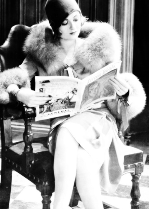 jeannecrains:  Constance Bennett reading Screen Book magazine