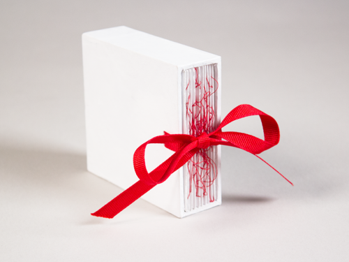 justpieit:  shihfu:  An old project from last year. One of a set of three. To extract the book from its box, both ends of the ribbons must be pulled at once. Pulling only one will get nowhere. Two people connected by the red string of fate are destined