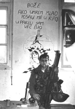 novichok5guy: Croatian soldier posing during the Balkan wars with a Croatian proverb back that translates as: “ God, if I die young I hope you send me to heaven because I’ve been in hell. ”