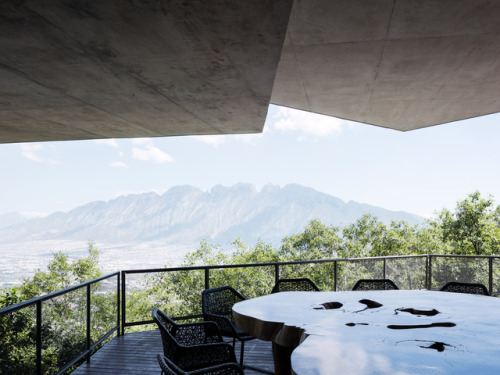 archatlas:  Ventura House in MonterreyThis house by Mexican architect Tatiana Bilbao comprises a cluster of five-sided concrete blocks that emerge from a forested hillside to offer panoramic views towards the city of Monterrey. The uneven terrain informed