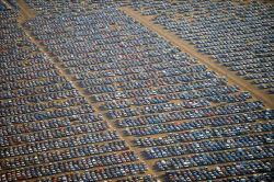 daph122:  stappls:  mrforde:  kakabuu:  christowl:  dearestqueer:  gladi8rs:  tllgrrl:  sciencevevo:mansfrombelow:canadian-communist: Where the World’s Unsold Cars Go to Die Above are photos of thousands and thousands of brand new, unsold cars in various