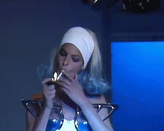 pradafied:  Linda Evangelista smoking a cigarette while walking the runway for Thierry Mugler - 1990 
