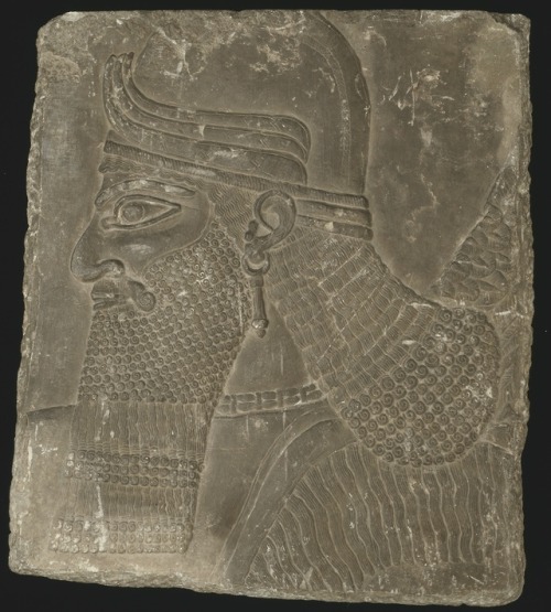 acronympathology:Relief Showing the Head of a Winged Genius made by the Assyrian people of the 