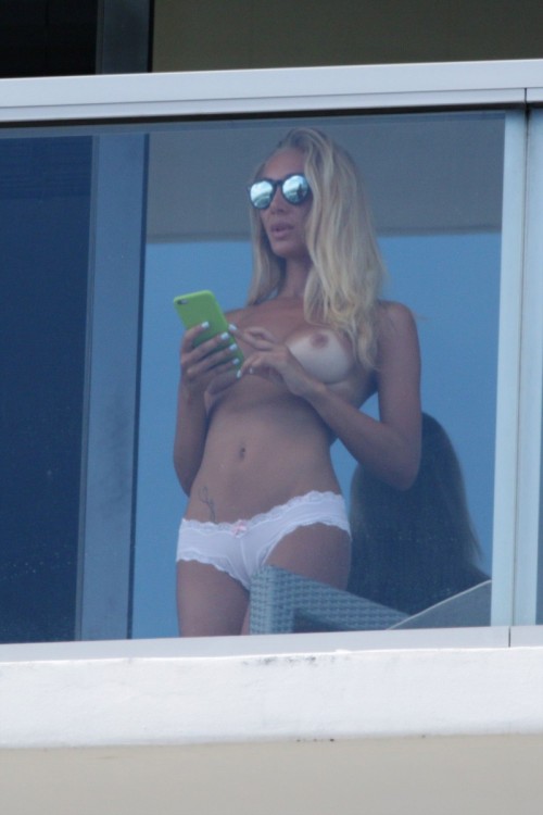 Italian model Laura Cremaschi caught topless on a hotel balcony in Miami Beach