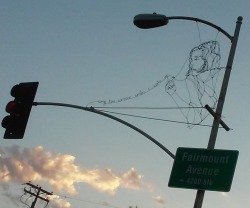 xrayi:  Was at the stop light, looked up and saw this. Some random wire street art on Fairmount &amp; Orange here in San Diego. Looked closer and it says, “every time someone smiles I wake up” 😀😀😀 