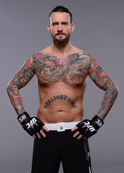 thepunknation:UFC Photoshoot Part One‘DALLAS, TX - MARCH 13:  Phil ‘CM Punk’ Brooks poses for a  photo during a UFC photo session at the Hilton Anatole Hotel on March  13, 2015 in Dallas, Texas. (Photo by Mike Roach/Zuffa LLC/Zuffa LLC via  Getty