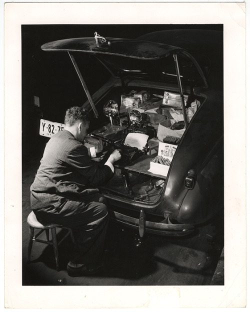 icphoto:A look at Weegee’s mobile office. It’s the back of his 1938 Chevy! Unidentified 