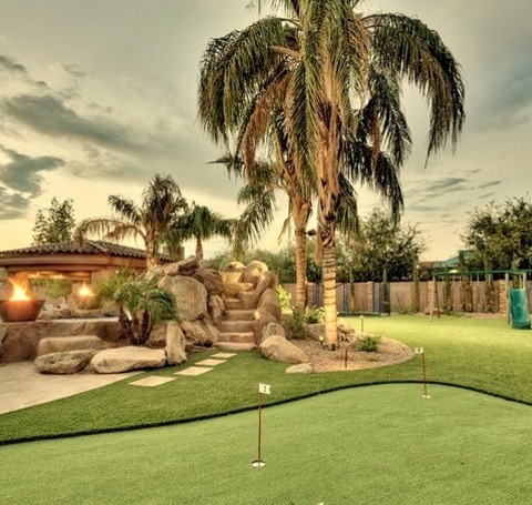 Phoenix Natural PoolLarge Mediterranean Backyard Natural Stone Pool Idea