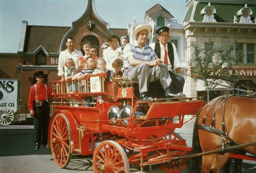 Walt on Main Street USA. 10 cents to ride the horse-drawn fire wagon, with Walt at the reigns. Who&r